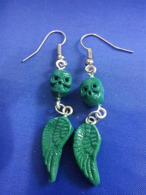 Green skull and drop wing earrings