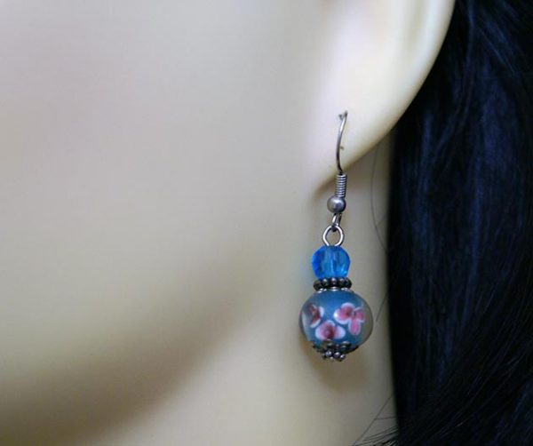 Blue 3D globe with pink flowers earrings