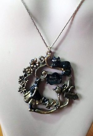 Gold and black Alice in wonderland silhouette cameo necklace