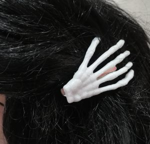 Iridescent skeleton hand hair clips